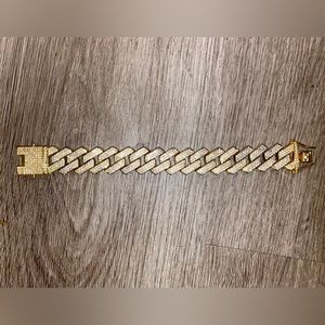 9 1/2 inch iced out gold plated diamond bracelet.